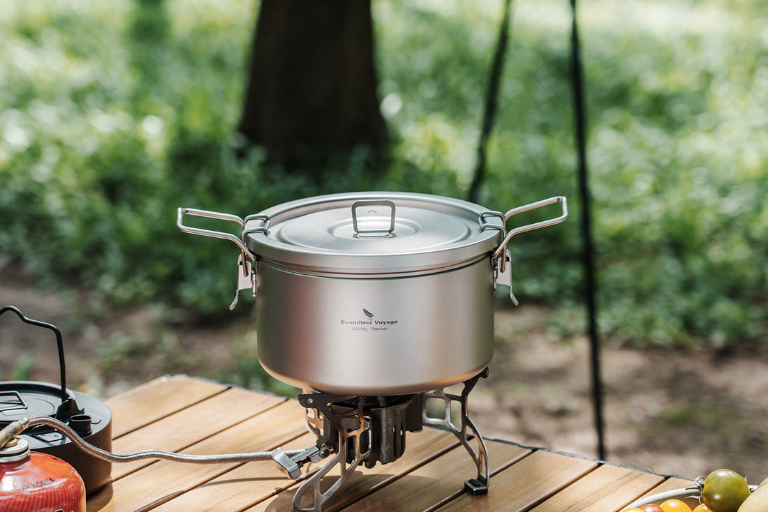 Boundless Voyage titanium camping pot on stove at outdoor campsite