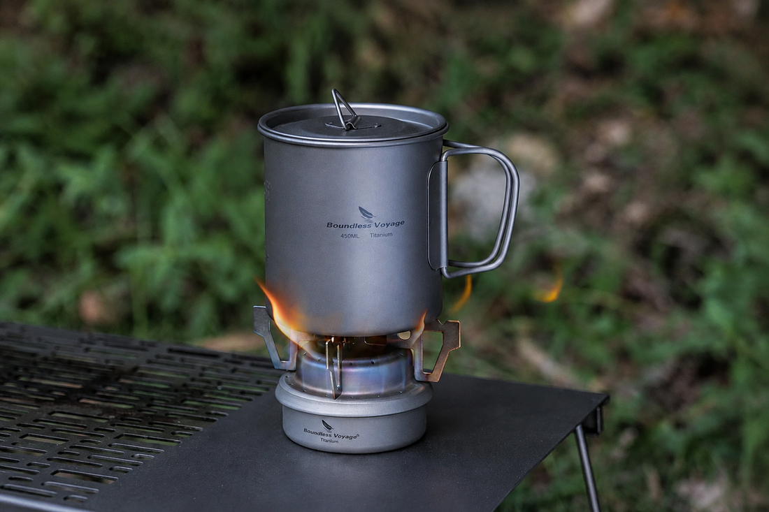 Titanium alcohol stove with camping cookware for outdoor cooking