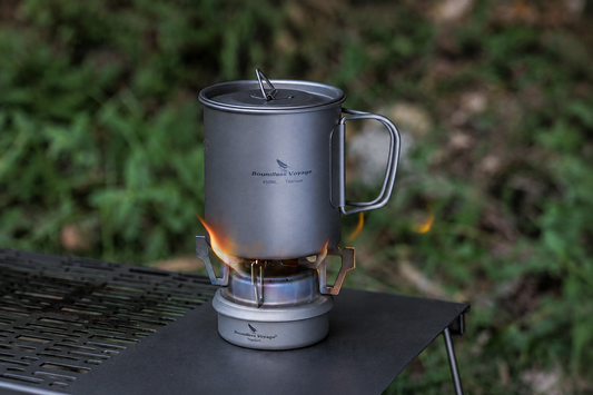 Titanium alcohol stove with camping cookware for outdoor cooking