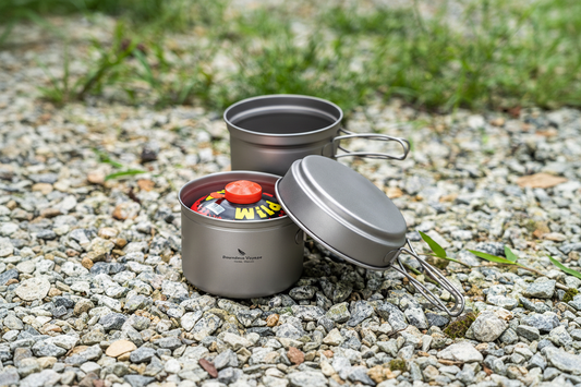 Boundless Voyage titanium camping pots on gravel outdoors