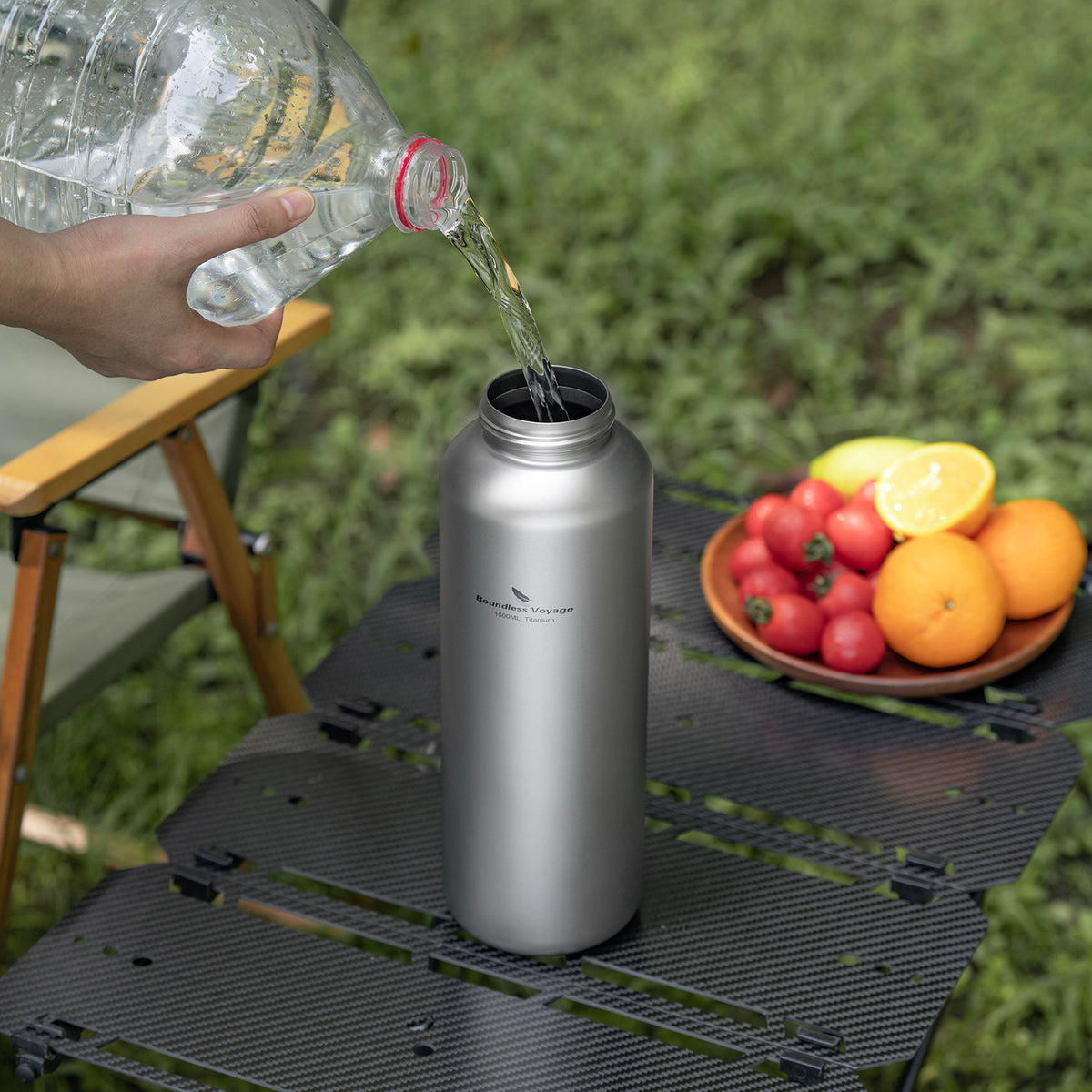Filling the wide-mouth 1500ml pure titanium water bottle outdoors