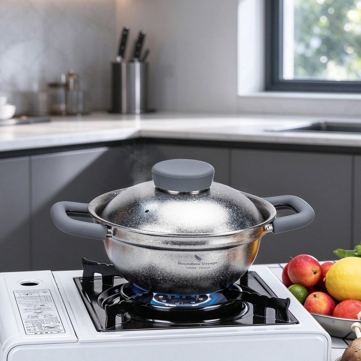 Boundless Voyage 1.2L titanium pot with crystalline lid simmering on gas stove top in modern kitchen