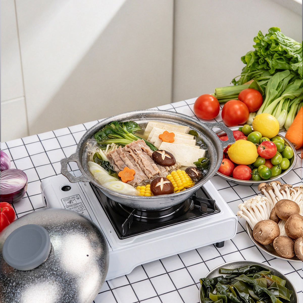 Family hot pot dinner table setup with Boundless Voyage 2.5L titanium cookware