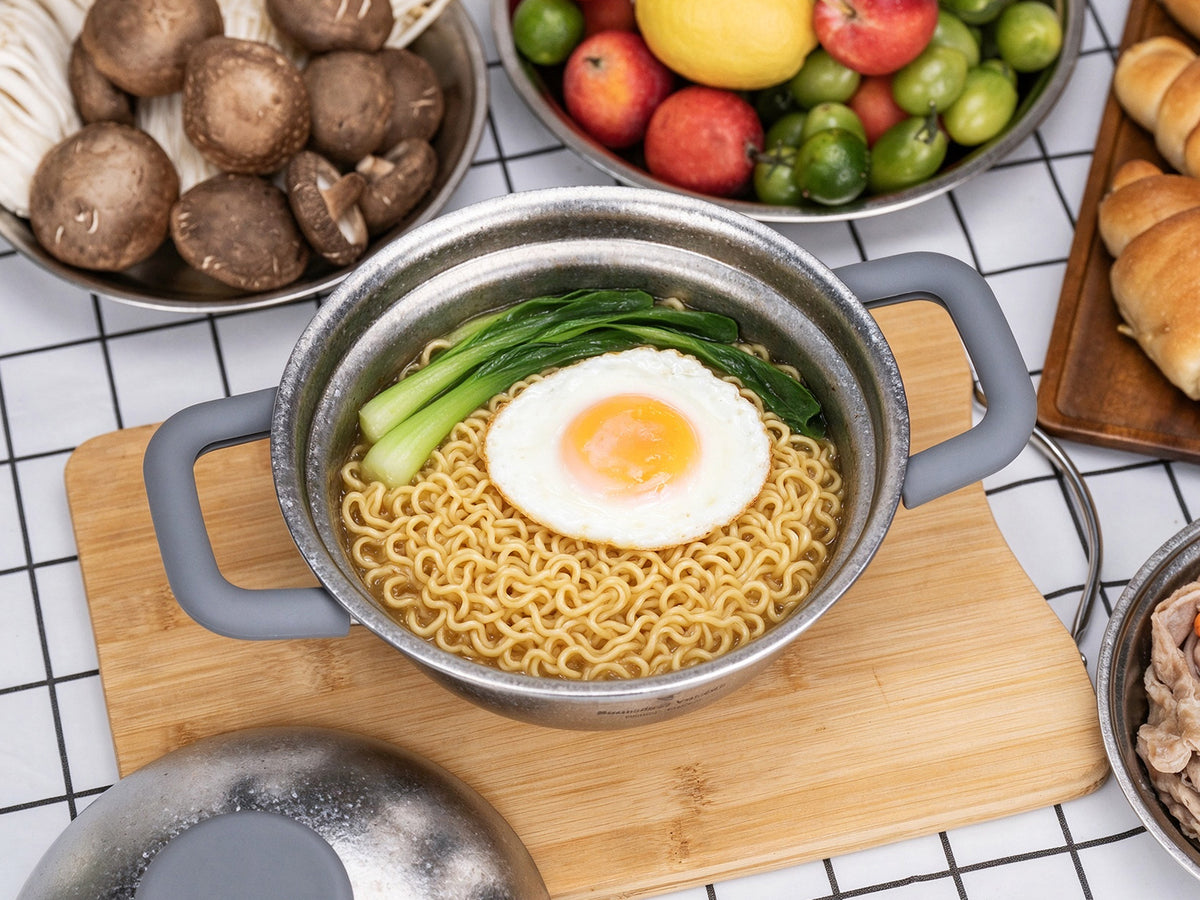 Delicious homemade claypot rice with sausage and fried egg served directly in Boundless Voyage 1.2L titanium pot