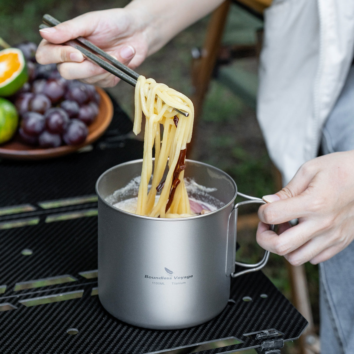 Ti2053C titanium pot heating on camp stove outdoors