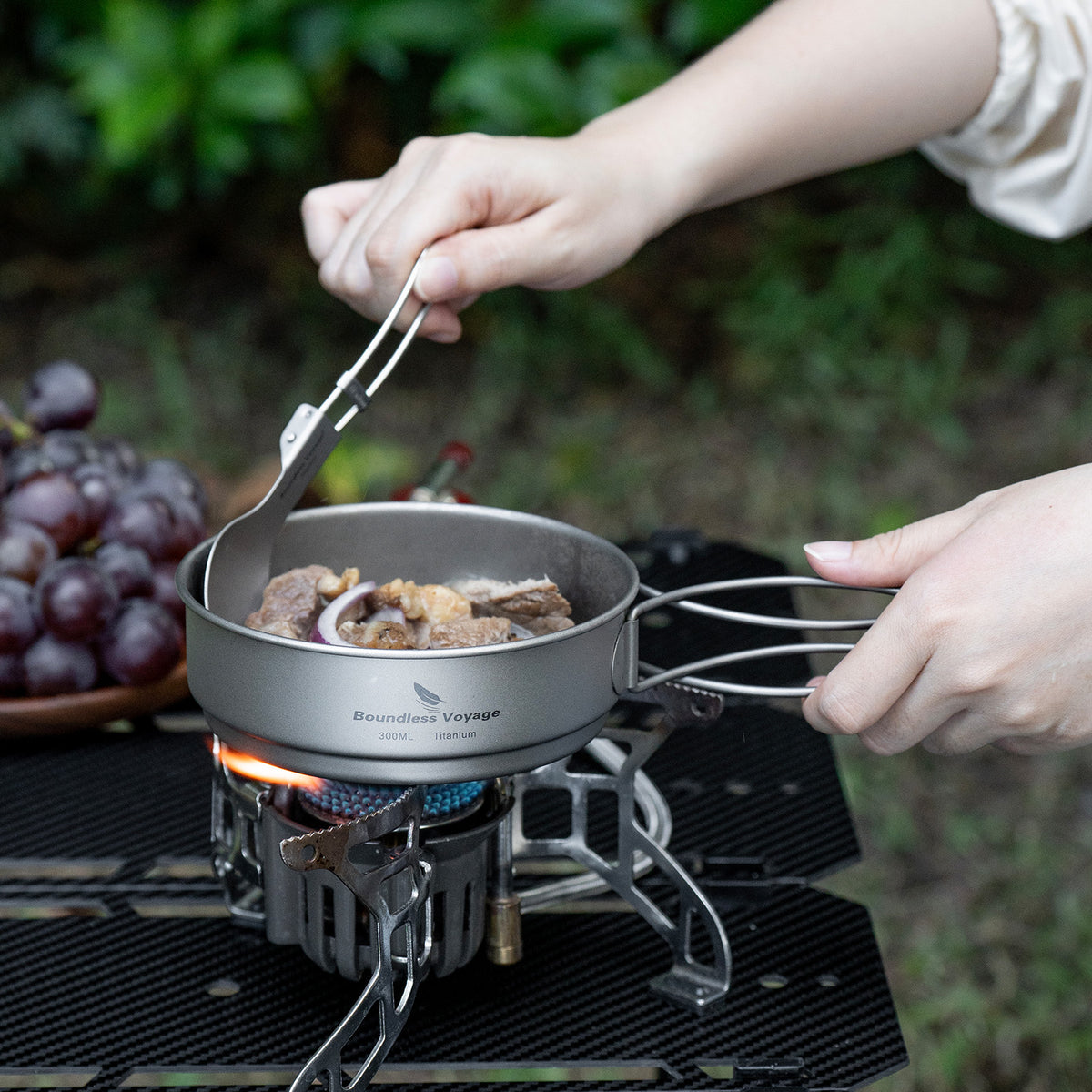 Ti2053C titanium mess kit laid out on rock in nature setting