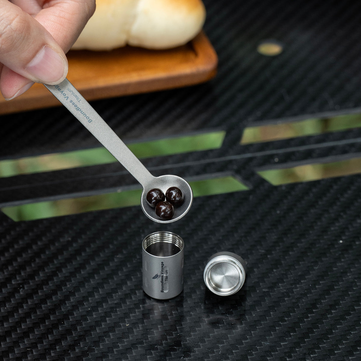 Filling medication into Ti9009A titanium pill case using small titanium spoon