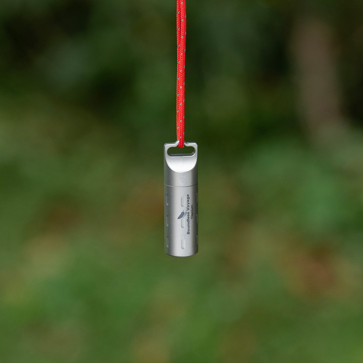 Red lanyard attachment on Ti9009B titanium long pill container for outdoor travel