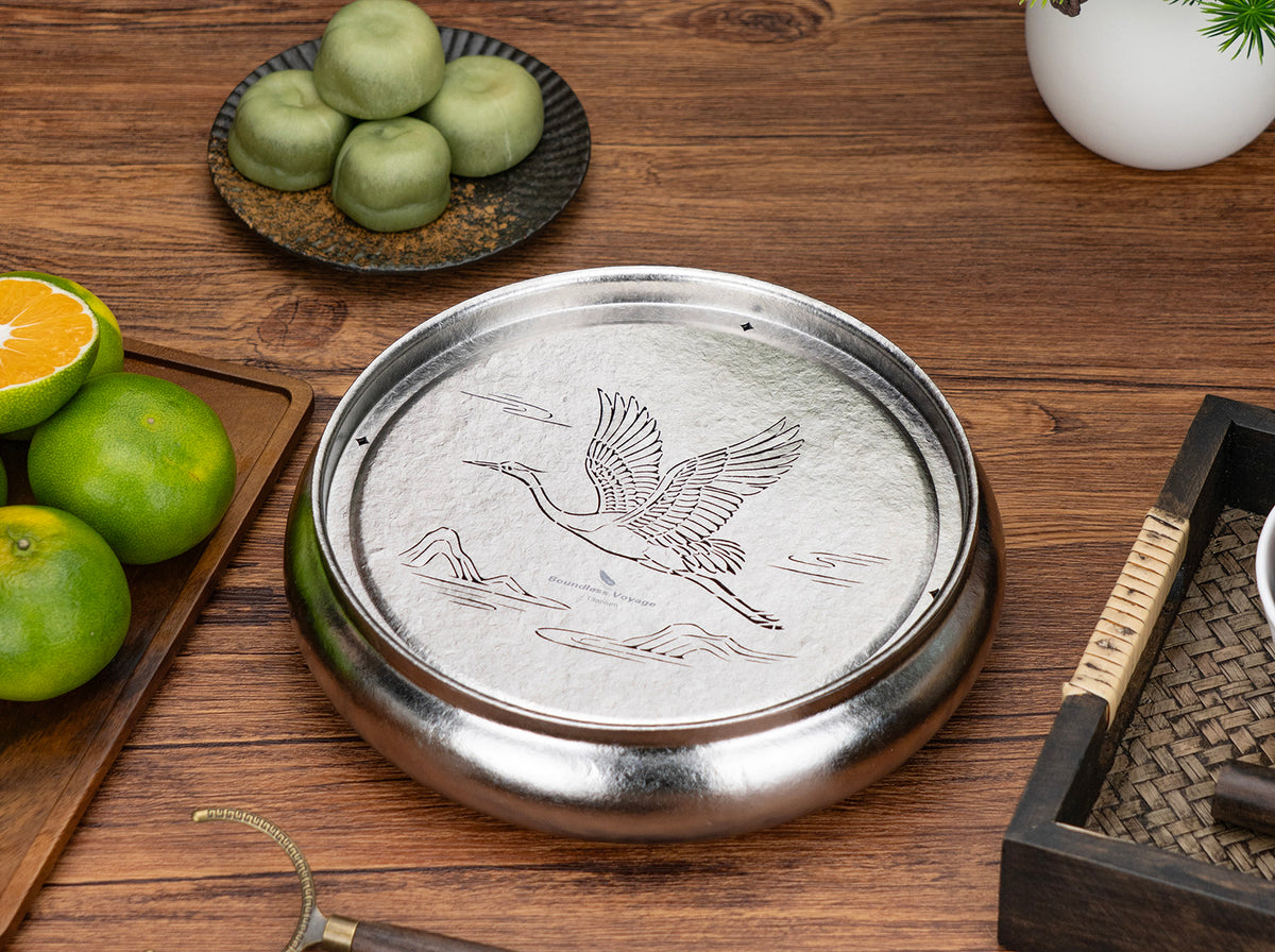 Boundless Voyage pure titanium round tea tray Ti3216D displayed on wooden table
